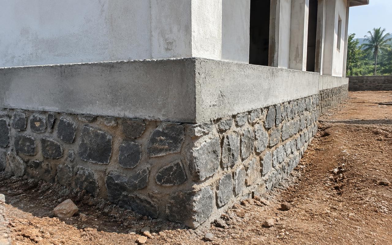 Stone masonry plinth and RCC plinth beam of a new house in Maharashtra